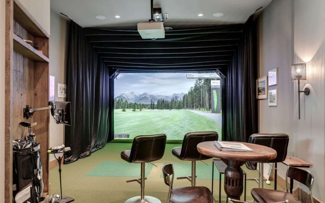 Luxury basement game room with golf simulator
